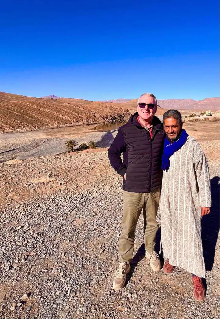 Guests with a Berber in traditional clothes