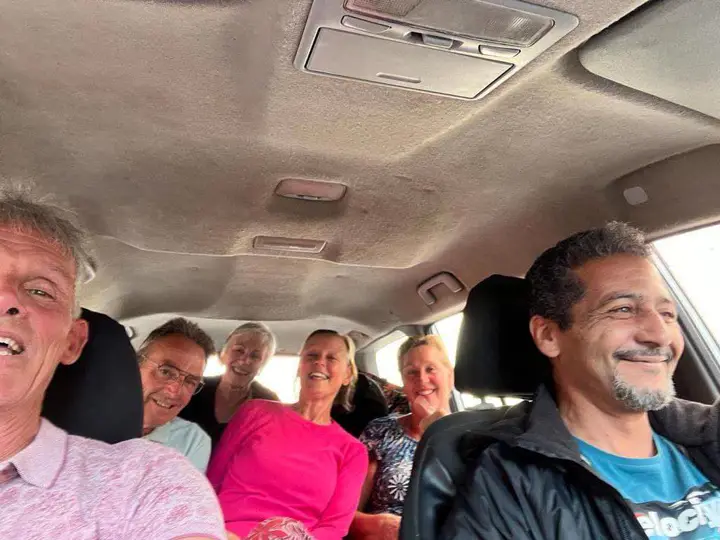 Happy guests in the car during the tour
